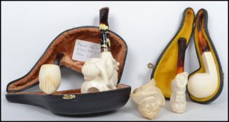 A collection of Meerschaum Pipes to include carved naked female with silver 925 collar ( cased ),