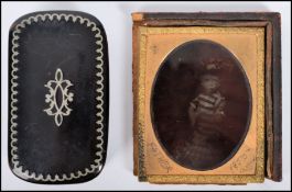 A vintage 19th century Georgian tortoise shell snuff box having silver inlay border work with
