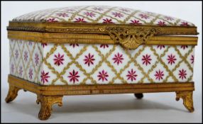 A stunning 19th century ceramic and ormolu jewellery casket, fitted with a hinged lid and raised