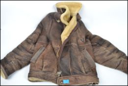 A retro 20th century leather flying style jacket with real sheepskin lining approx size large