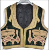 An unusual 20th century believed continental hand embroidered waistcoat adorned with green velvet