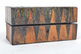 An early 20th century Tunbridge ware box having geometric patterns with opening to reveal three