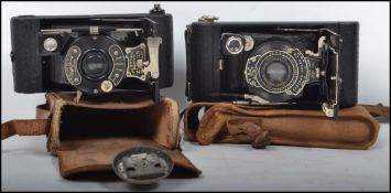 Two vintage 20th century fold out cameras, one being an Ensign Pocket All Distance Synchro A