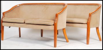 A pair of matching two seat French Empire revival canape sofa's  dating from the 20th century