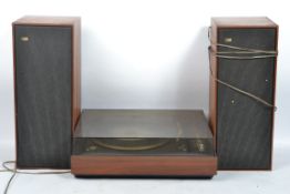 A retro 20th century Bang and Olufsen Beogram 1500 record deck with a pair of retro teak cased