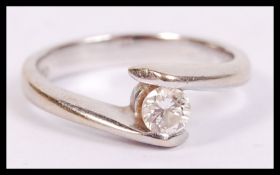 An 18ct gold single stone diamond ring in white go