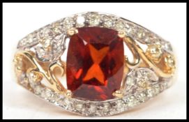 A 14ct yellow gold and tourmaline, diamond ring complete in the presentation case