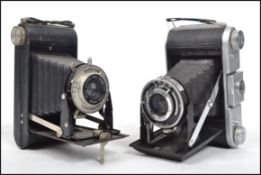 A vintage Ensign  Ranger Special bellows camera with Ensar lens together with a Kodak brownie camera