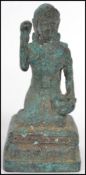 A 19th century Oriental bronze figure of a Buddha moulded in a kneeling position with jar to hand