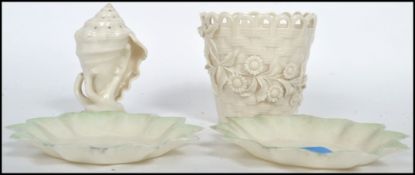 A collection of four pieces of Bone China Belleek porcelain, to include two scalloped dishes, one