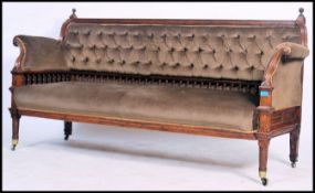 A good Victorian oak gallery back salon sofa settee being raised on turned legs with brown velour