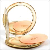 A vintage silver hallmarked Kigu ladies compact, having engine turned decoration London assay mark