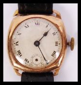 An early 20th century vintage gents 9ct gold wristwatch with roman numeral chapter ring and