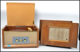 A vintage mid 20th century portable wooden cased four speed record player Pye, speaker to front