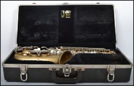 A vintage Selmer Bundy II saxophone and mouthpiece complete in original type. Case measures: 25 cm