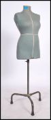 A vintage 20th century Singer dress makers female mannequin bust raised on an ebonised adjustable