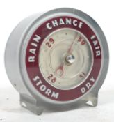 A vintage 20th century Joseph Lucas table barometer of circular car light form, marked to verso