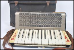 Musical Instruments. A cased vintage 20th century German made Pietro piano accordion in its original
