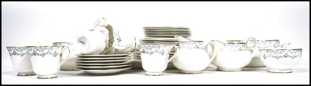A vintage 20th century Royal Doulton tea and dinner service decorated in the Candice H5142 pattern
