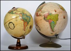 Two vintage 20th century desktop globes one being an antique style Heritage example and the other
