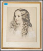 A framed and glazed 19th century pastal / charcoal portrait picture of a young girl. Signed to the