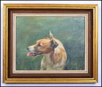 An oil on canvas naive portrait painting of a Jack Russel dog signed to the corner P Radmall,