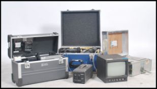 A retro 20th century professional video recording camera by Sony together with monitor and power