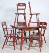 A 1950's Imperial Loyalist furniture, draw leaf dining table and 6 chairs bearing resemblance to