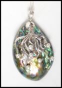 A very good silver mounted abalone shell pendant necklace in the form of a squid adorned with