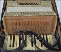 A vintage 20th century Alvari accordion musical instrument complete in original case. Case measures: