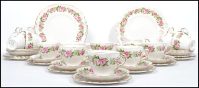 An extensive bone China tea service by Colclough in a floral chintzy pattern, 29 pieces in total
