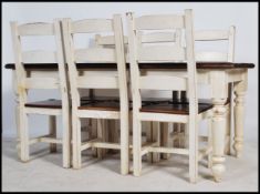 A 20th century shabby chic / up-cycled farmhouse table having painted legs and freeze with waxed