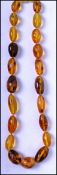 A vintage amber bead necklace of small proportions having a barrel twist clasp measuring 18 inches