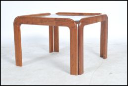 A 1960s G-plan style coffee table having four teak