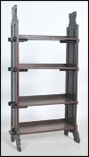 An early 20th century arts & crafts oak slatted bookcase in the manner of Liberty. The upright