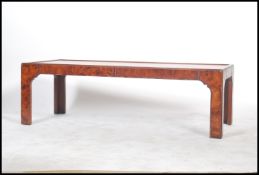 A Chinese style walnut rectangular coffee table wi