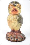 An unusual 20th century ceramic tobacco jar canister in the form of a grotesque bird being  in the