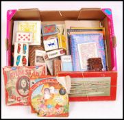 A collection of vintage 20th century board games, playing cards and puzzles. To include Snow White