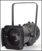 A good Strand 20th century electric theatre / cinema spot lamp of cylindrical form with barn doors