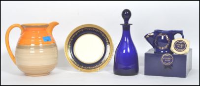 A large early 20th century Shelley jug having a banded bee hive design with shaped handle and lip