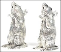 A good pair of continental silver 800 marked table condiments, each in the form of mice  ( see
