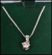 A ladies contemporary 18ct white gold single stone diamond pendant necklace of approx 38pnts