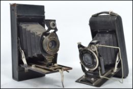 A vintage Zeiss Ikon bellows camera with Carl Zeiss lens Tessar 1:4.5 together with a Kodak No2 a