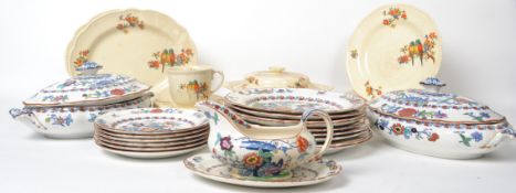 A vintage 20th century Booths ceramic floral pattern dinner service along with a parrot ware