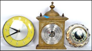 A Majik Russian crystal clock along with a Metamec yellow and chrome circular clock and a brass