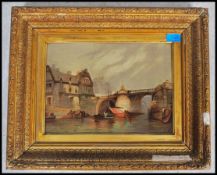 A 19th/20th century oil on board painting of a continental river scene being framed. Unsigned.