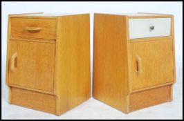 A near pair of early oak E-Gomme / Gplan bedside cabinets having one drawer and cupboard to each.