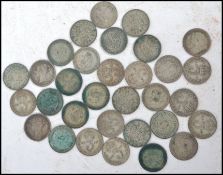 A collection of 31 silver three pence coins dating from the 19th century to include coins dating