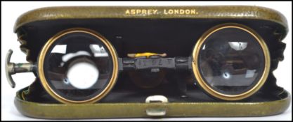 A pair of vintage 20th century Asprey of London La Mignonne metamorphic opera glasses in a green