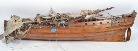 A large 20th century scratch built wooden model of a ship having sails and masts.